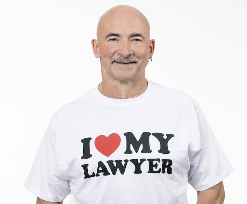 Henry Carus + Associates client Mark Connor wearing 'I Love My Lawyer' shirt